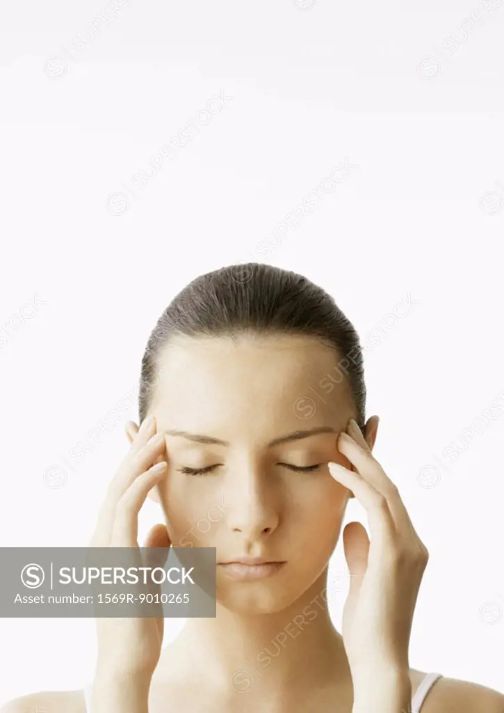 Woman with fingers on temples