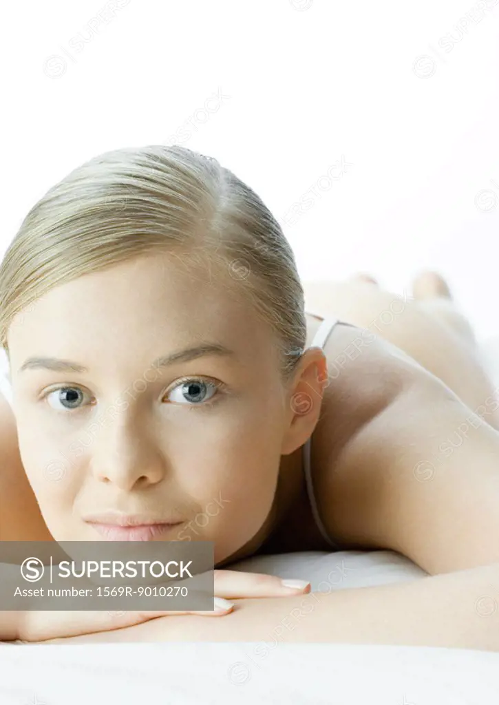 Woman resting head on hands, portrait