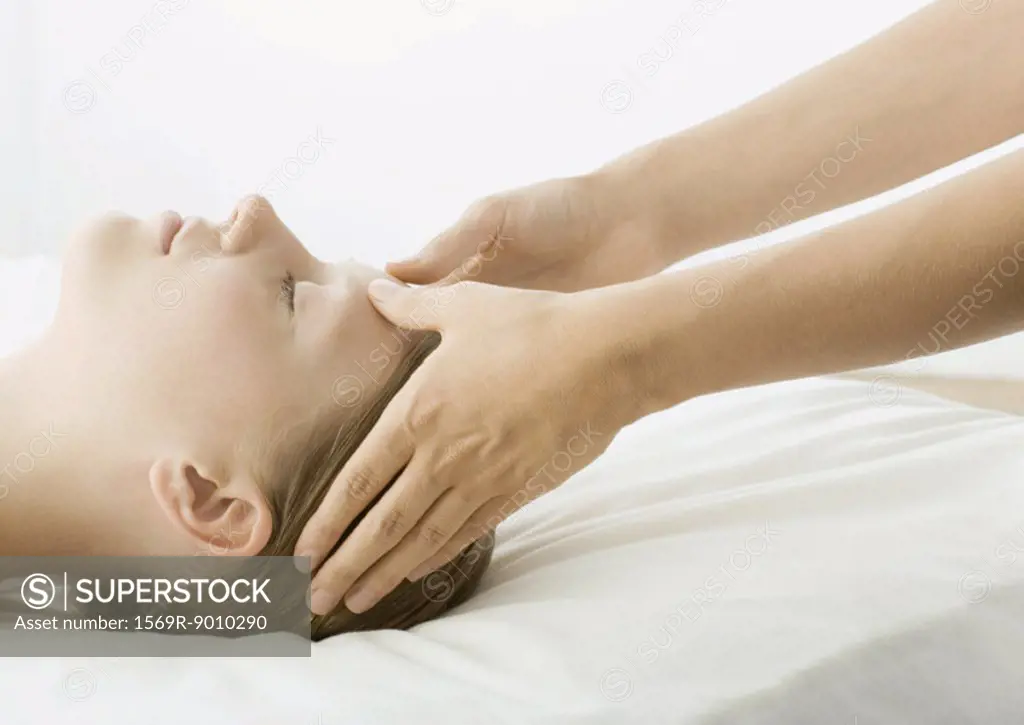 Woman having head massage