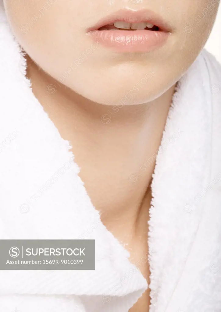 Woman´s lower face and neck with towel around shoulders