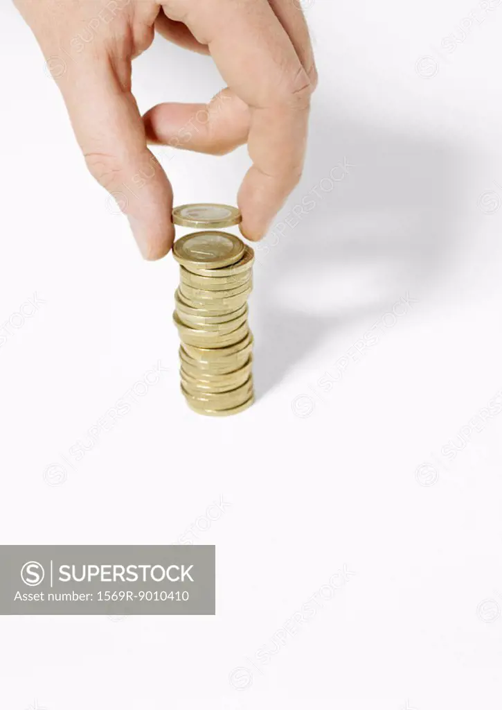 Hand stacking coins