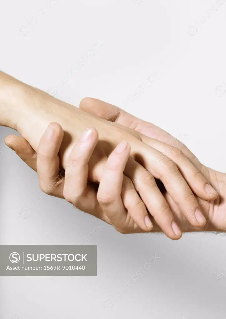 Man holding woman´s hand
