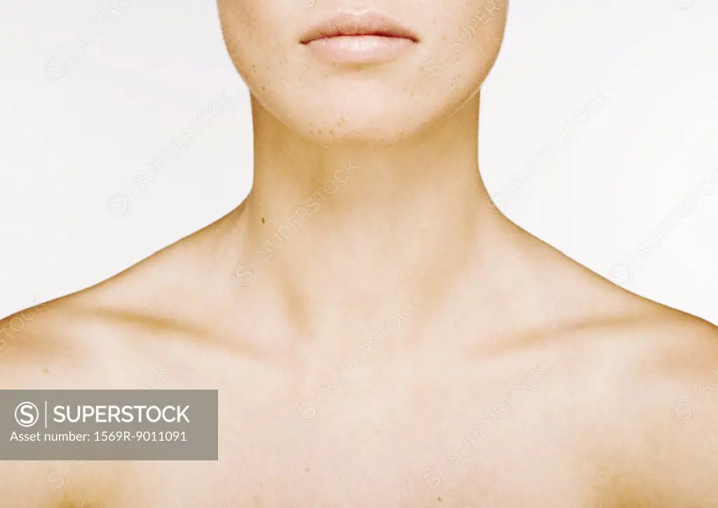 Woman´s lower face, neck and bare upper chest - SuperStock