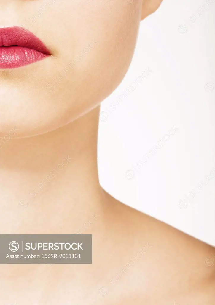 Woman wearing lipstick, view of lower face and neck