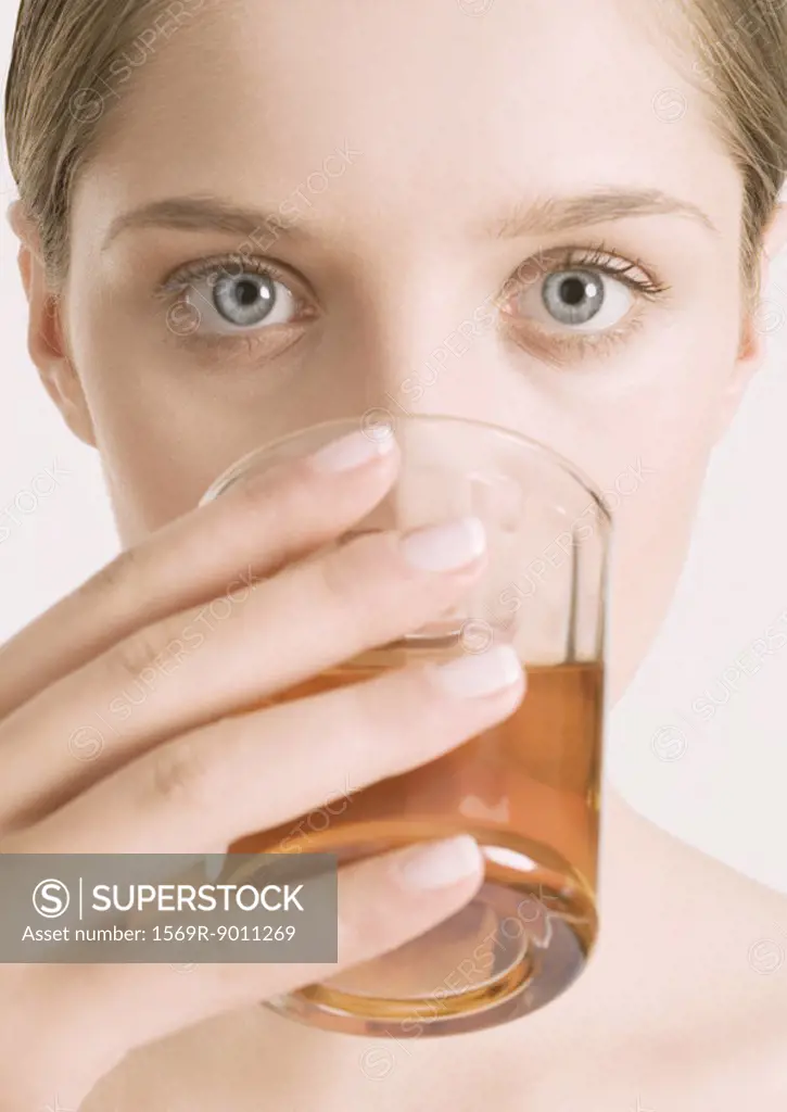 Woman drinking tea, close-up