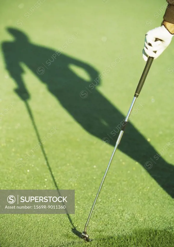 Shadow of golfer
