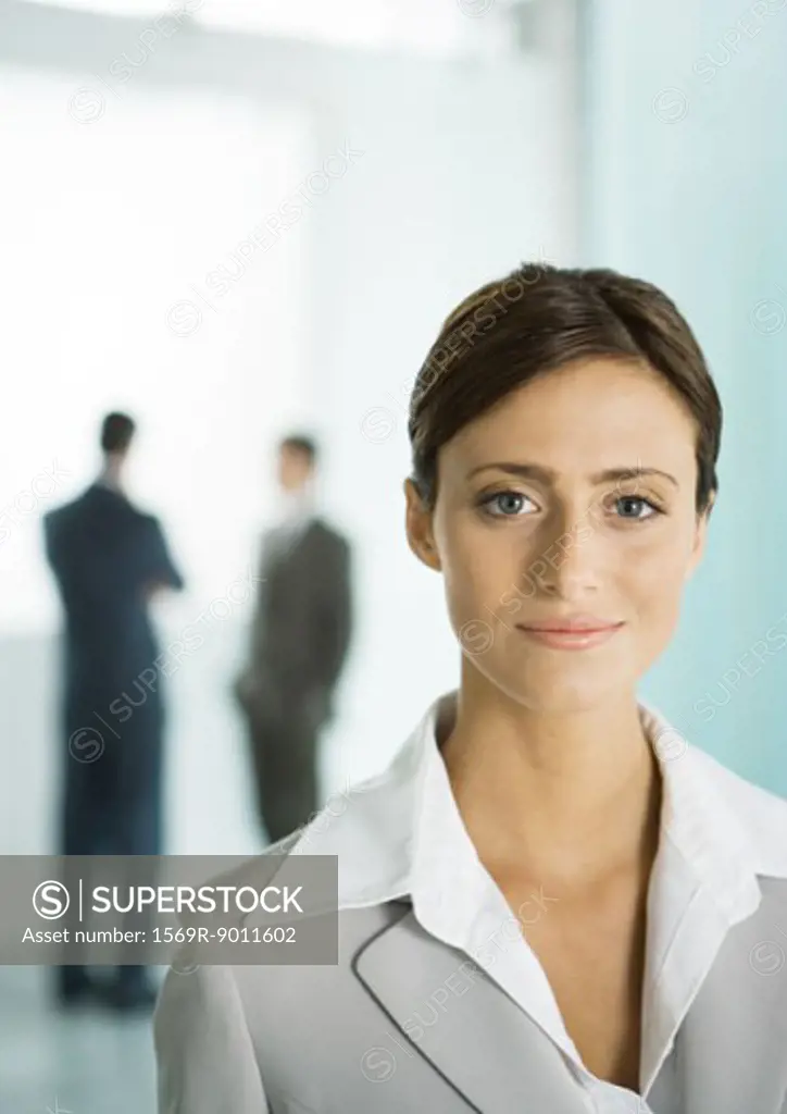 Businesswoman in office lobby, portrait
