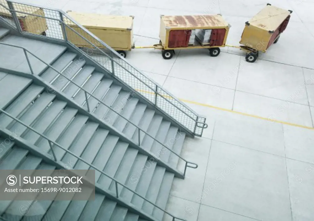 Stairs and cargo containers on tarmac