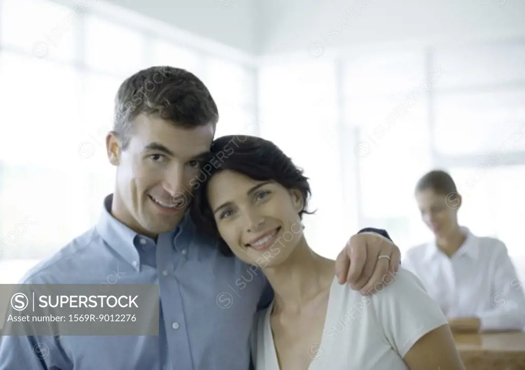 Couple standing in front of reception desk