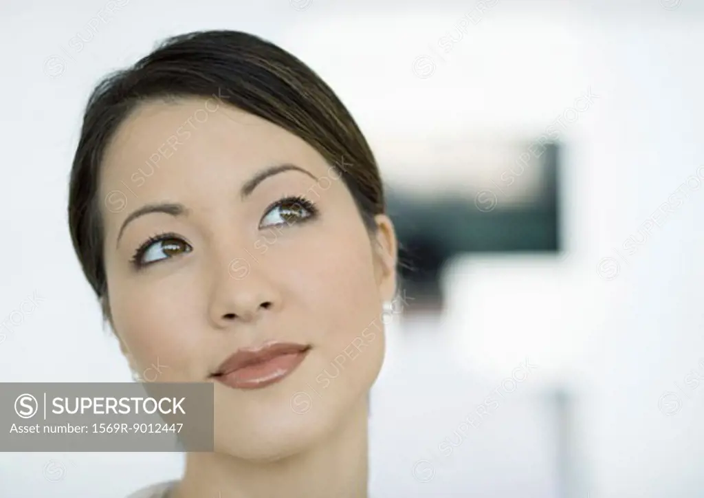 Woman looking away, close-up of face