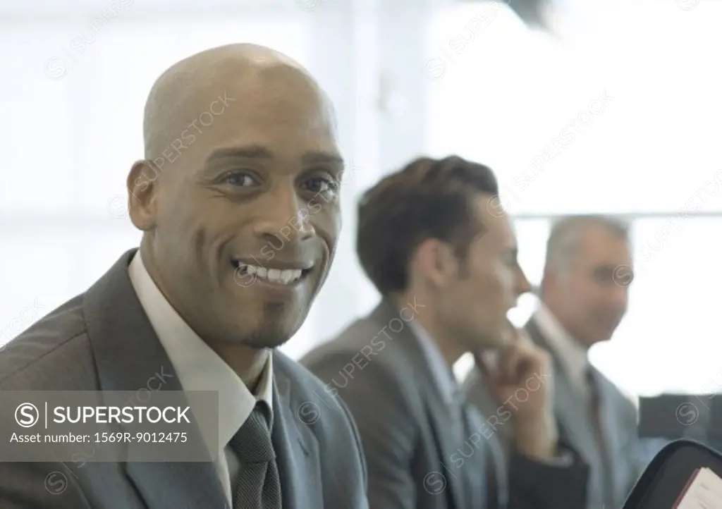 Businessman smiling at camera