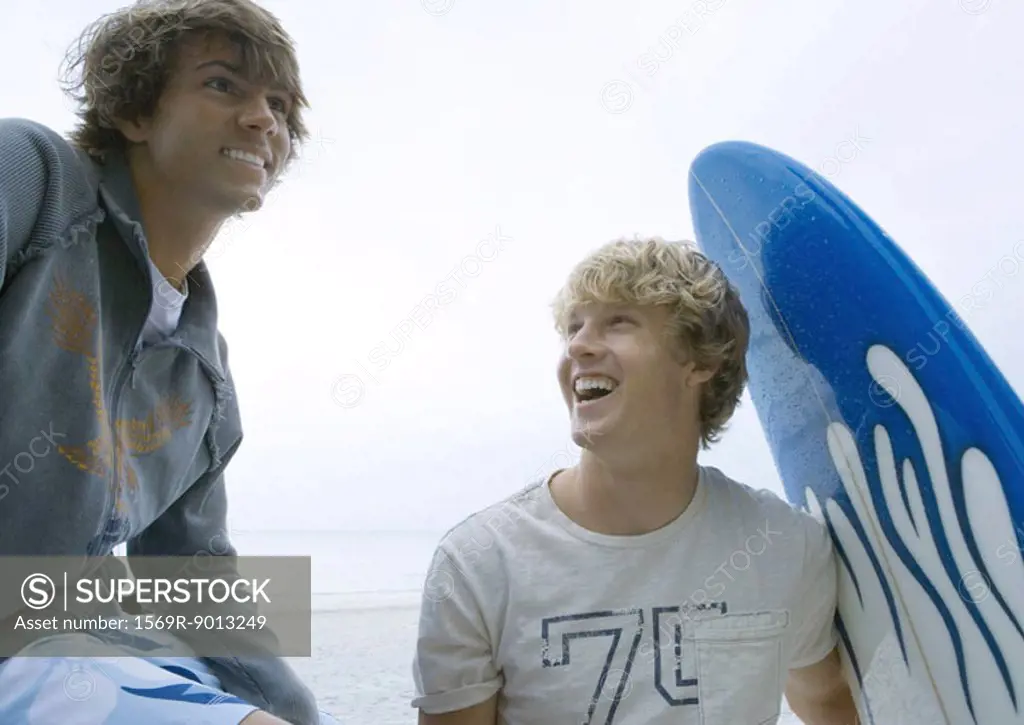 Young men with surfboard