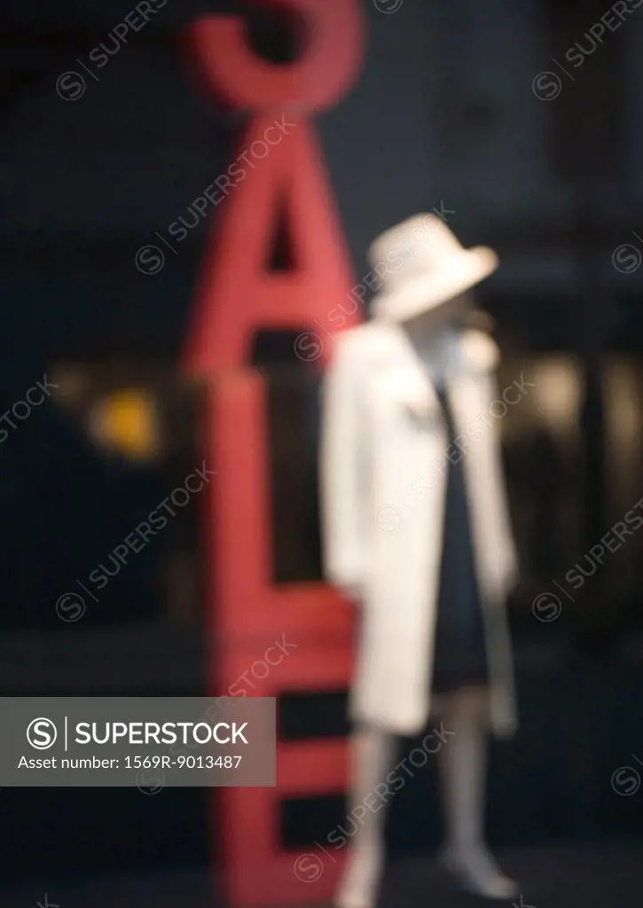 Mannequin and sale sign