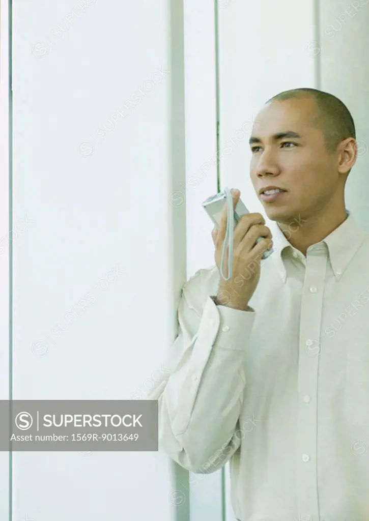 Man using dictaphone