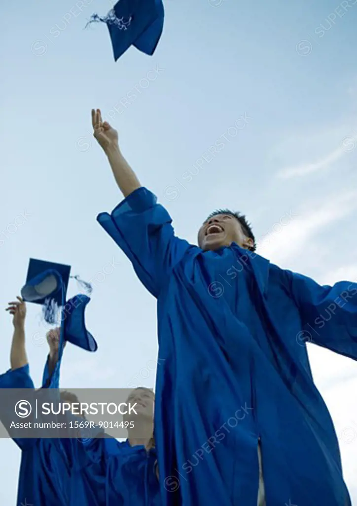 Graduates throwing caps