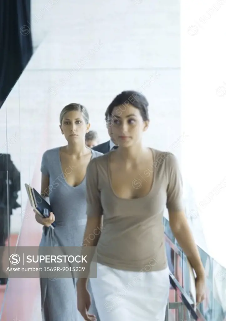 Businesswomen walking toward camera
