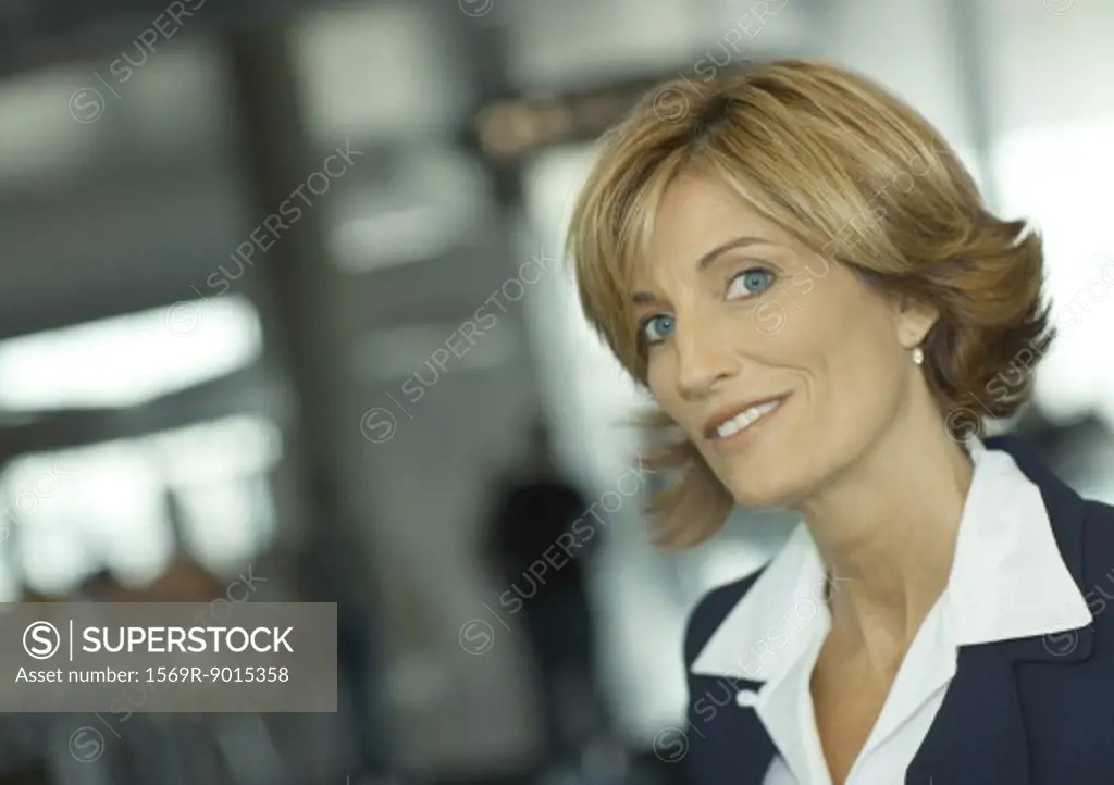 Mature woman smiling at camera, portrait
