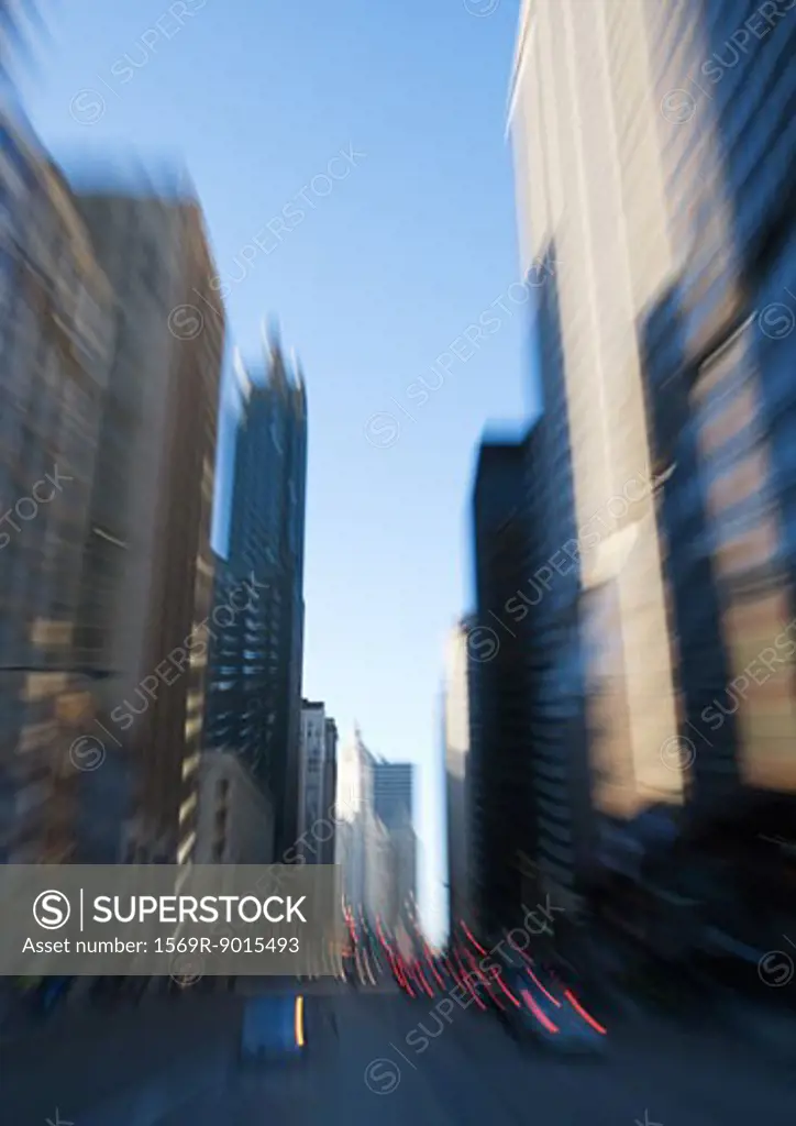 Chicago street lined with skyscrapers, blurred motion
