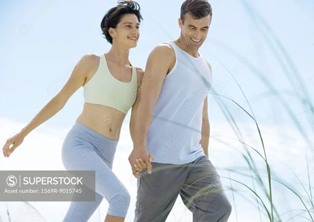 Couple walking in exercise clothes