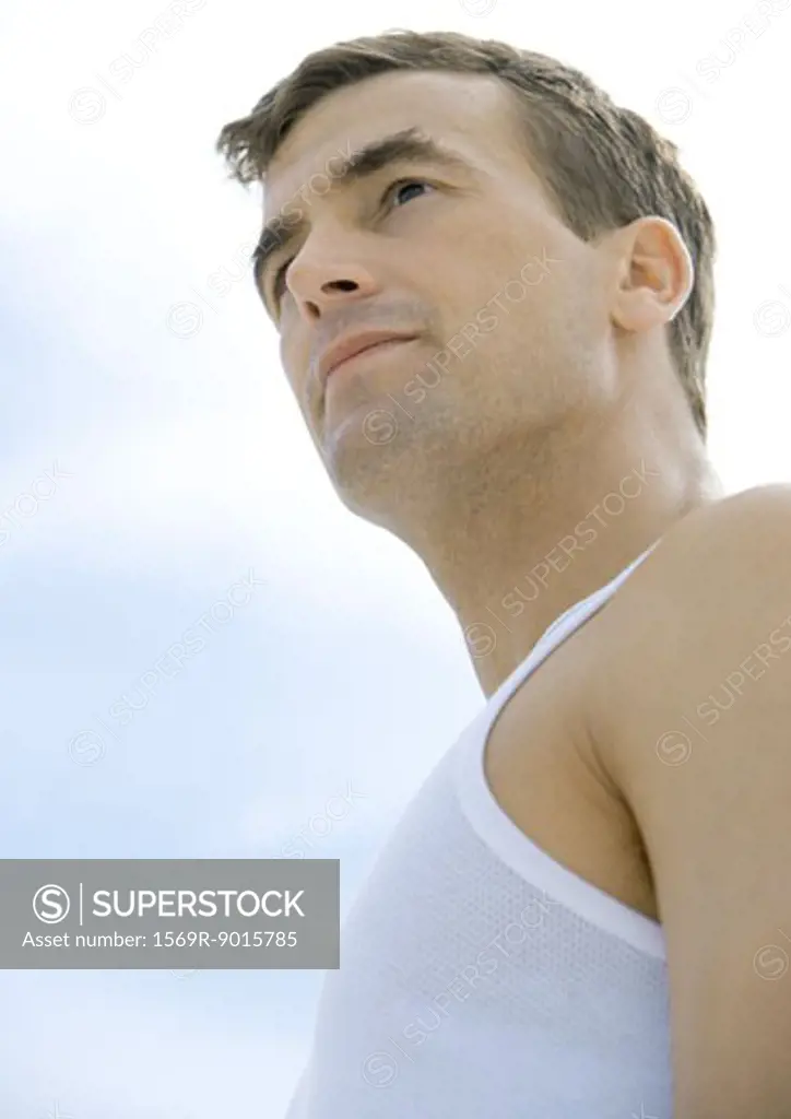 Man looking into distance, low angle view