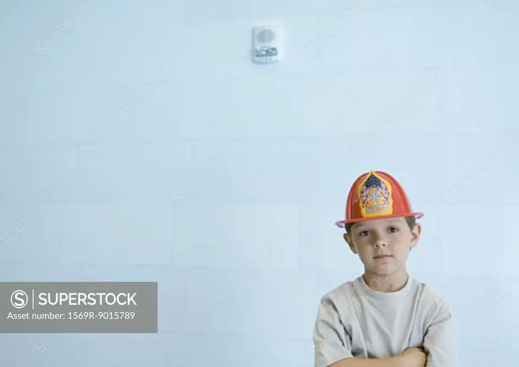 Boy wearing fireman's hat
