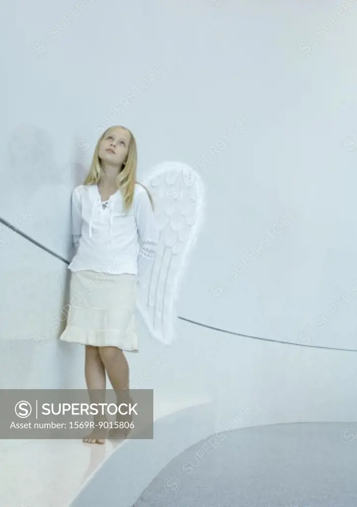 Girl wearing angel wings
