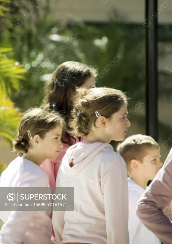 Group of children, looking in same direction