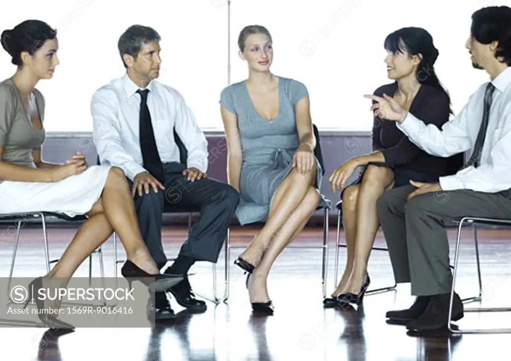 Executives sitting, having discussion