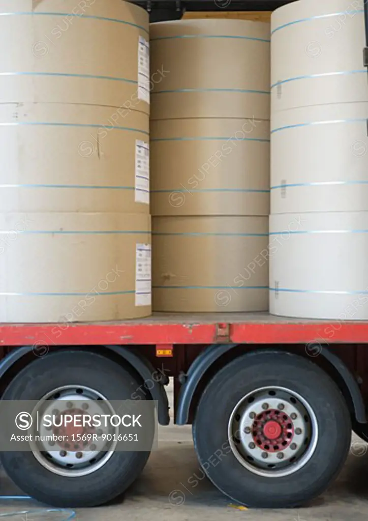 Rolls of paper stacked on truckbed