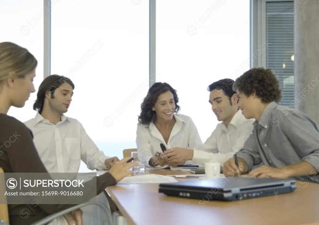 Business associates talking in conference room
