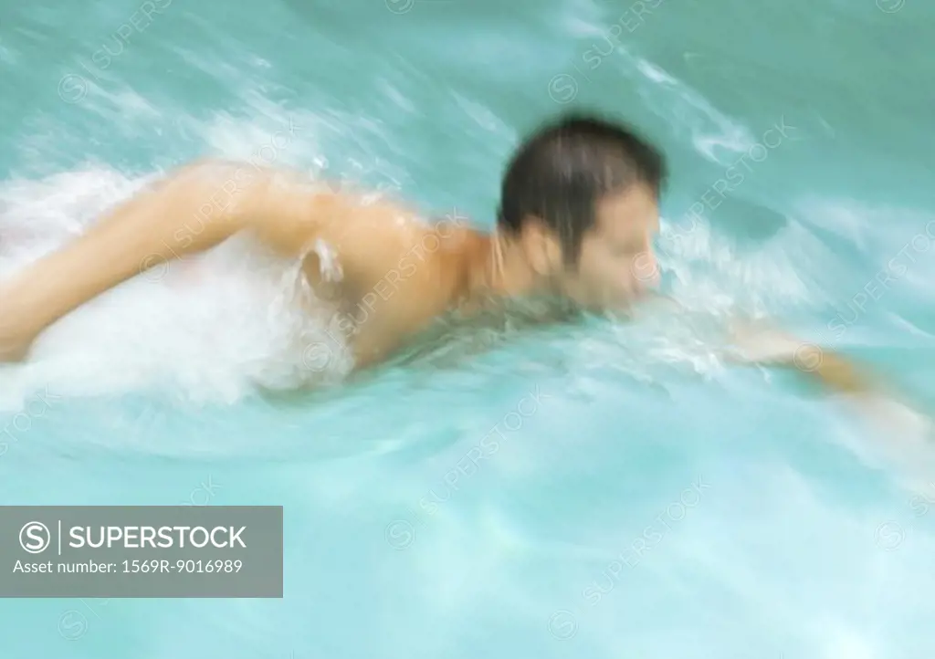 Man swimming, blurred motion