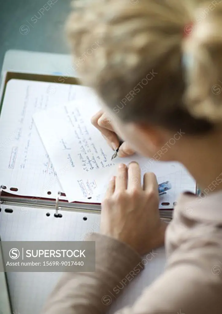 Preteen girl doing homework