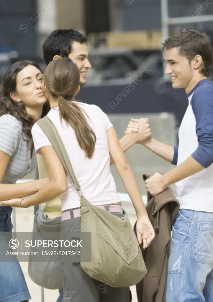 Teens greeting each other
