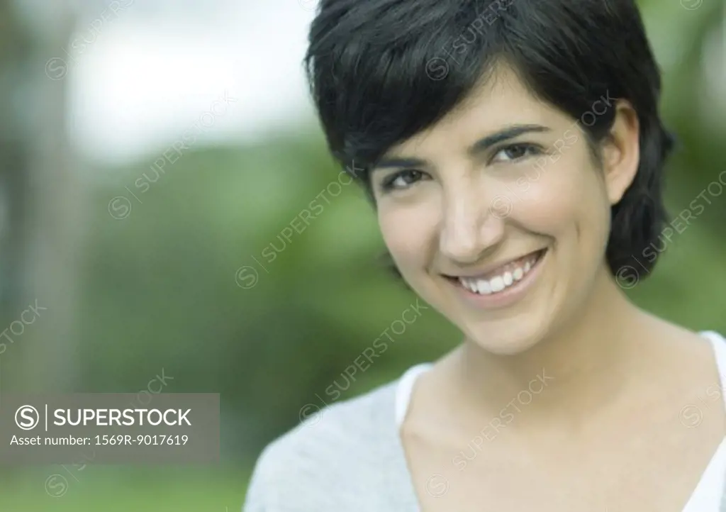 Mid-adult woman, smiling at camera, portrait