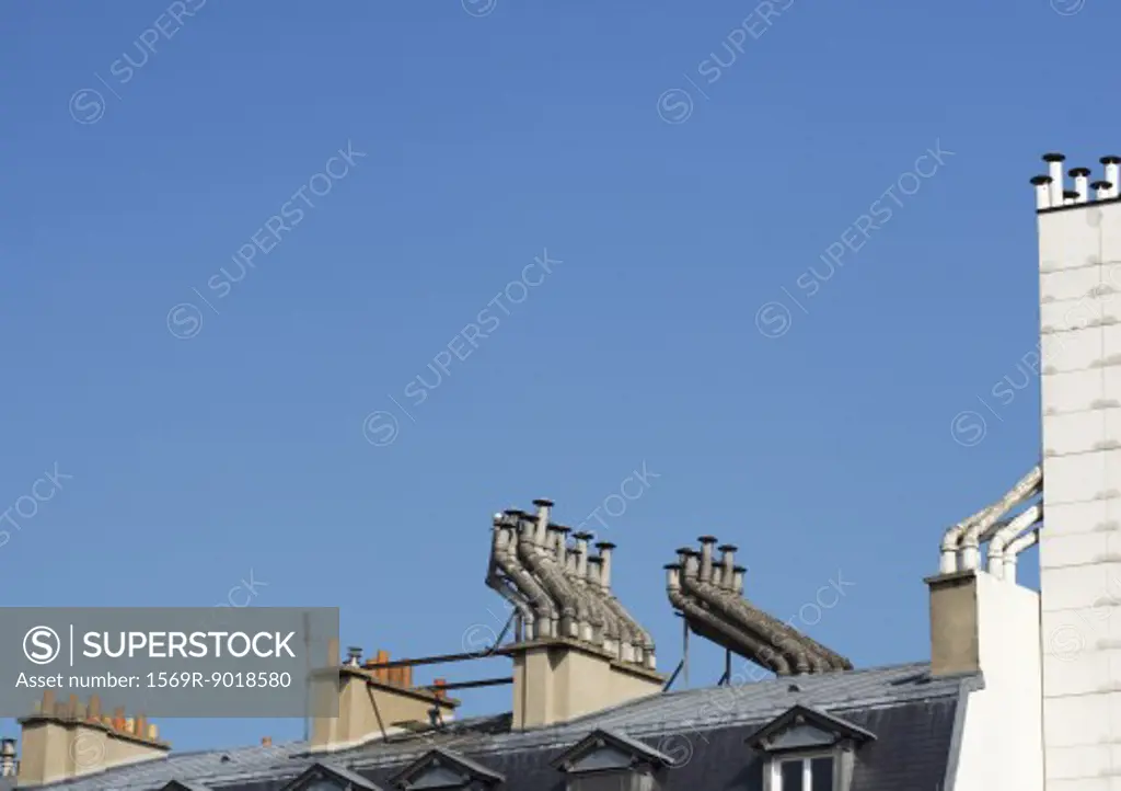 Smoke stacks on top of apartment building