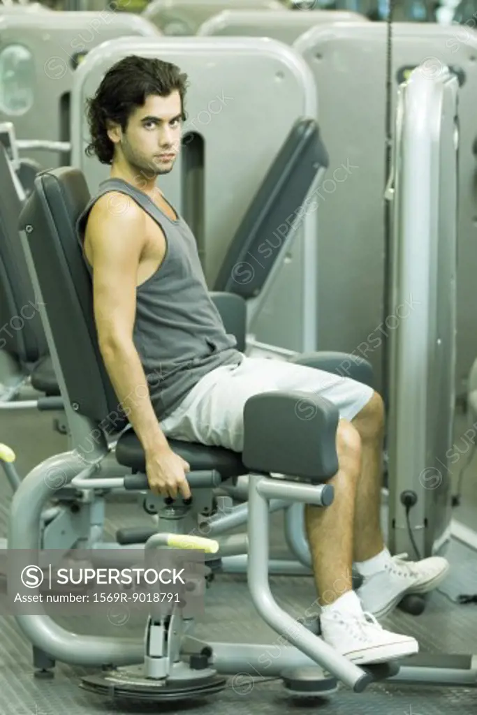 Man working out on weight machine