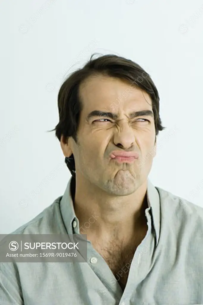 Man making sour face, portrait