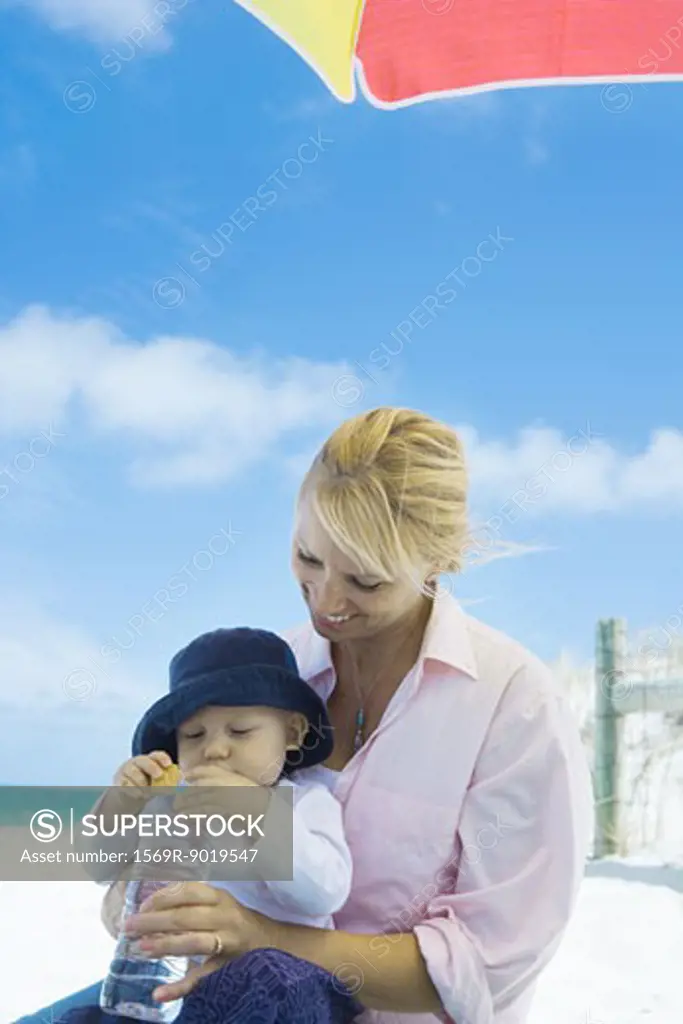 Baby with mother on beach