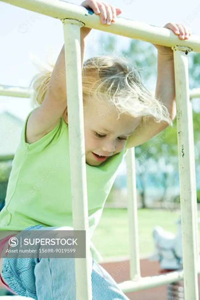 Child on playground equipment