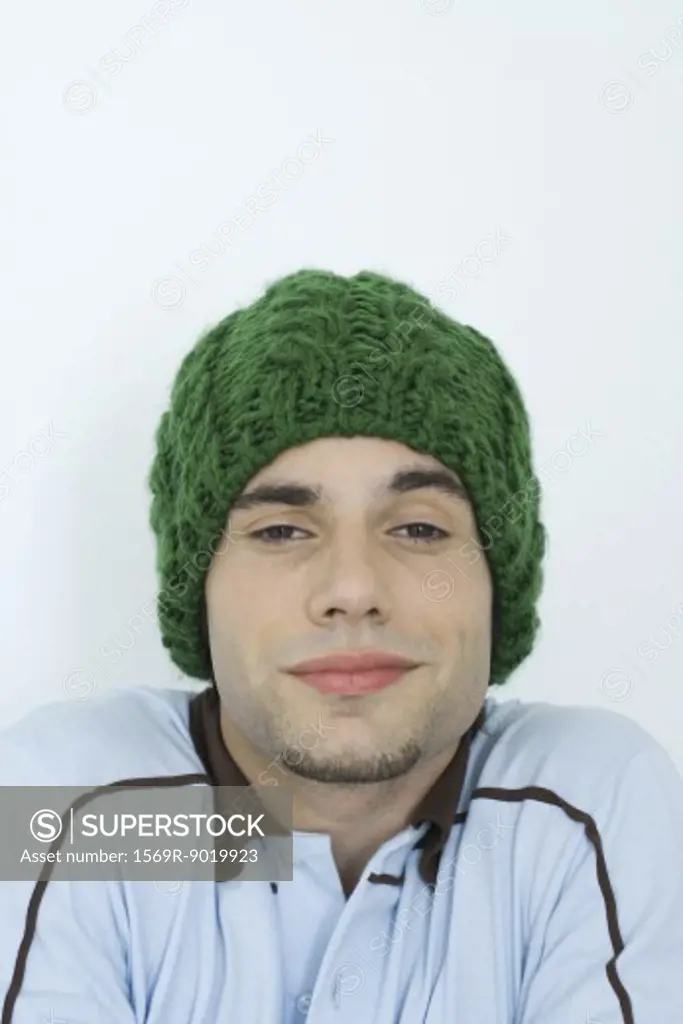 Young man wearing knit hat, portrait, close-up