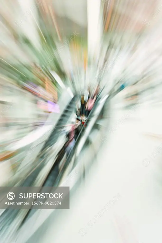 People on escalator, blurred motion