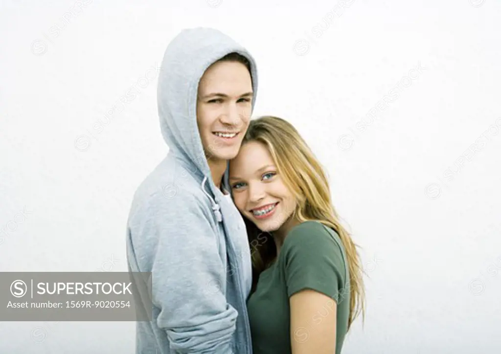 Young couple, woman leaning head on man's shoulder