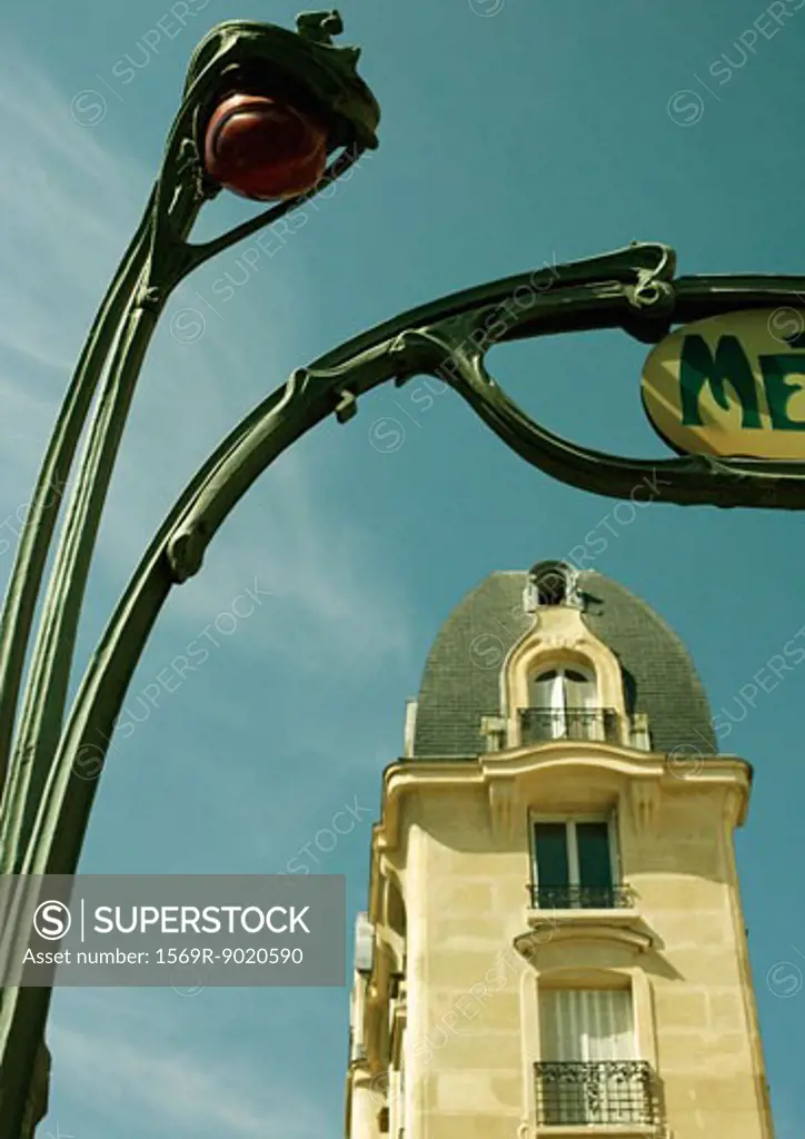 Paris, France, metro entrance and building, cropped view