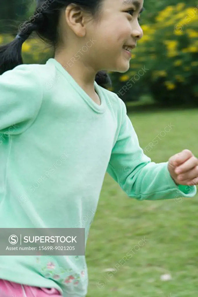 Little girl running, close-up