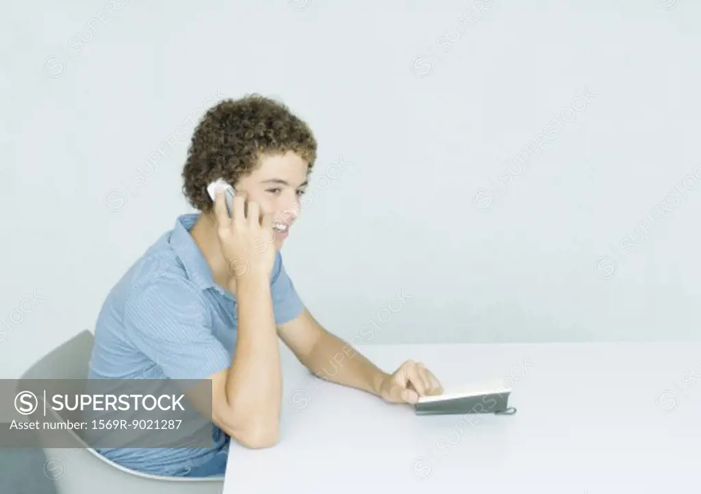Teenage boy using cell phone