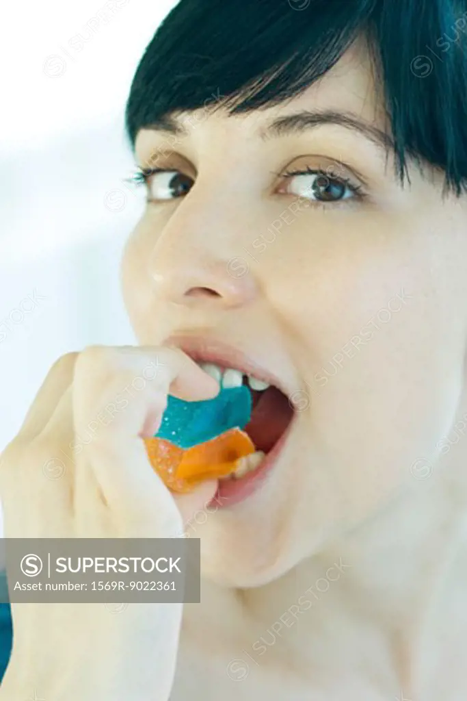 Woman eating candy