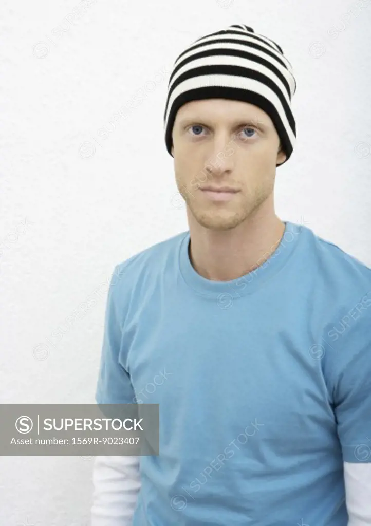 Young man wearing knit hat, portrait