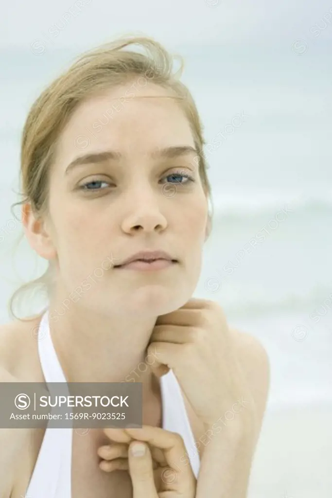 Young woman, head and shoulders, portrait, sea in background