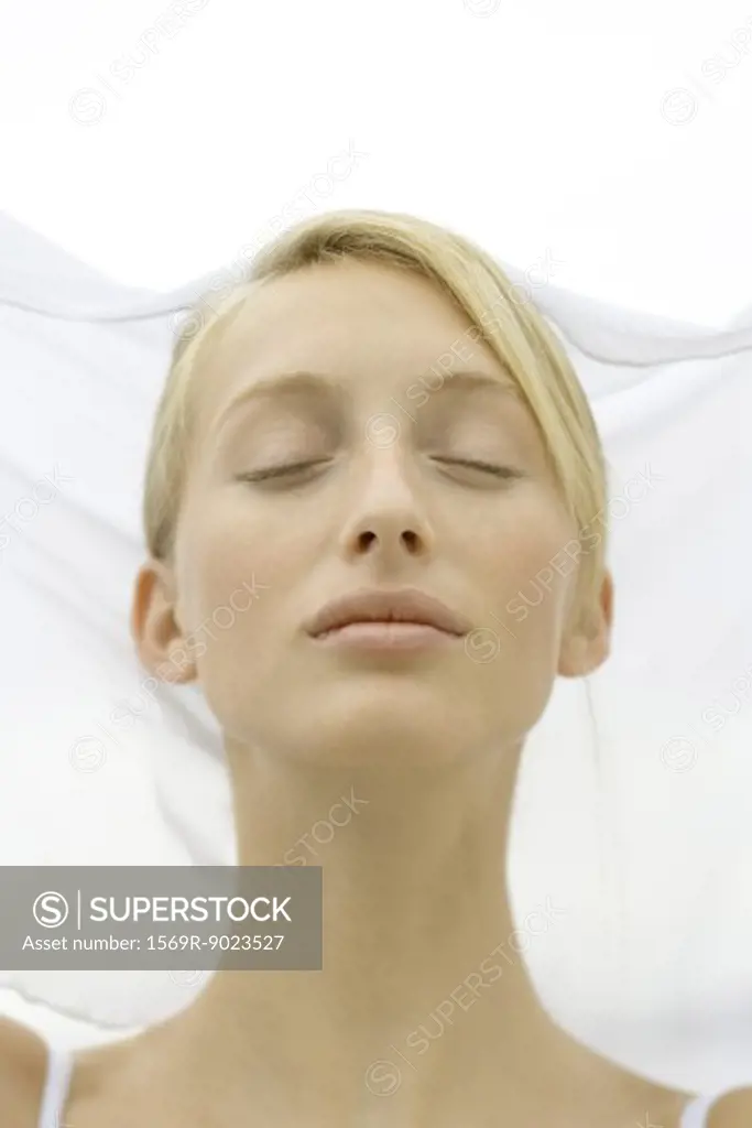 Teenage girl eyes closed, head and shoulders
