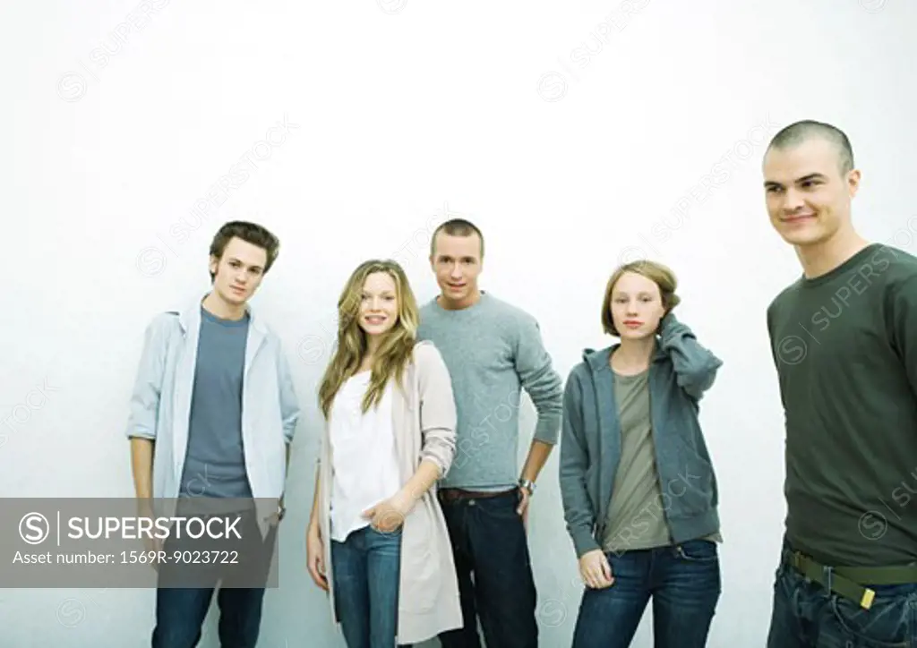 Group of young adult and teenage friends, white background